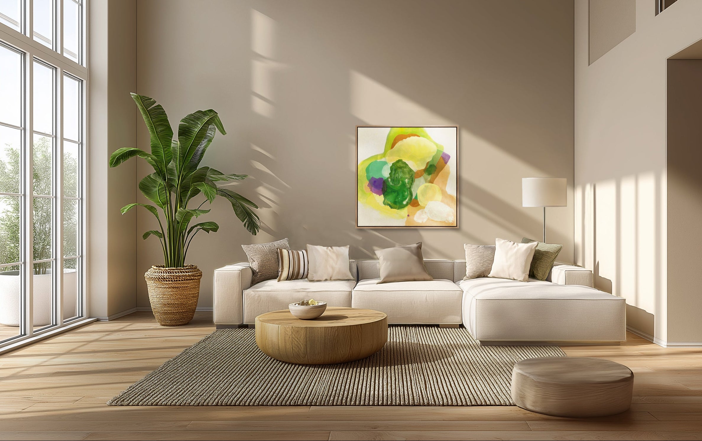 The Frog, abstract fine art print on canvas in a floating frame of sustainable sourced wood in a natural finish. This artwork has nature inspired abstract shapes with playful movements in  green, white, violet, sand tones, yellow-greenish. Hanging in an airy soulful modern livingroom, sand coloured walls. Large windows and a white modern low seated sofa with cushions in neutral colours. A low round sofa table in wood on a textured rug in beige. Big green plant in corner. Ingeborg Andersson Art