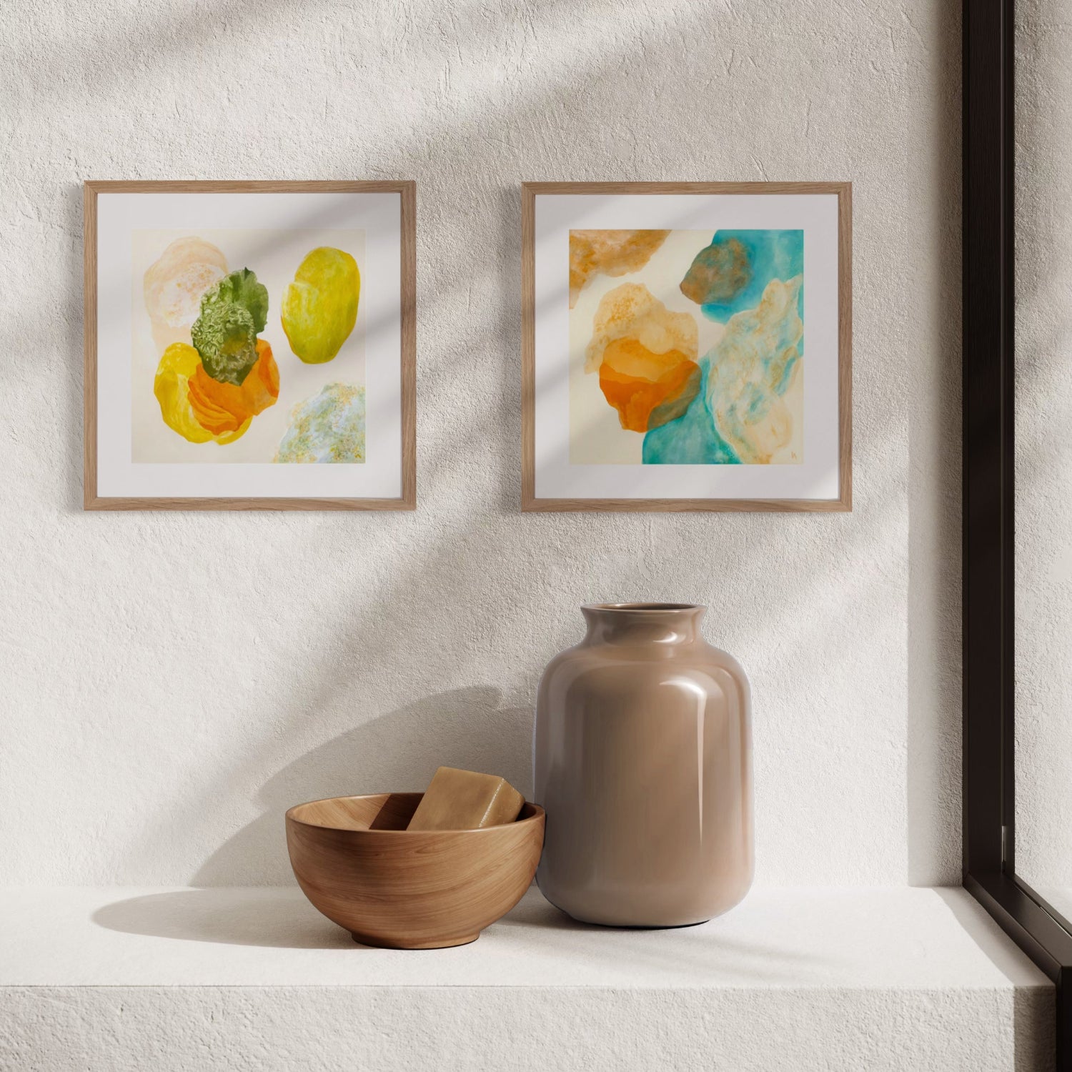 Blue and green mini art prints displayed as part of a calming gallery wall.