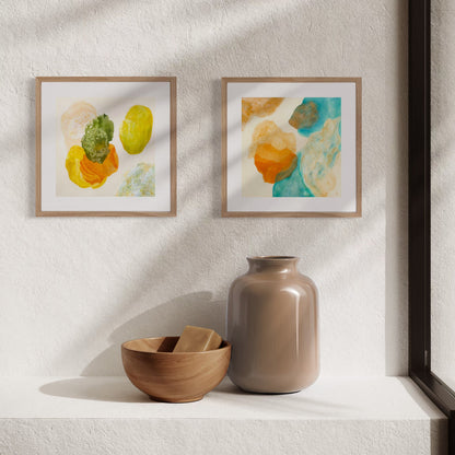 Blue and green mini art prints displayed as part of a calming gallery wall.