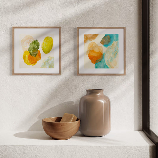 Blue and green mini art prints displayed as part of a calming gallery wall.