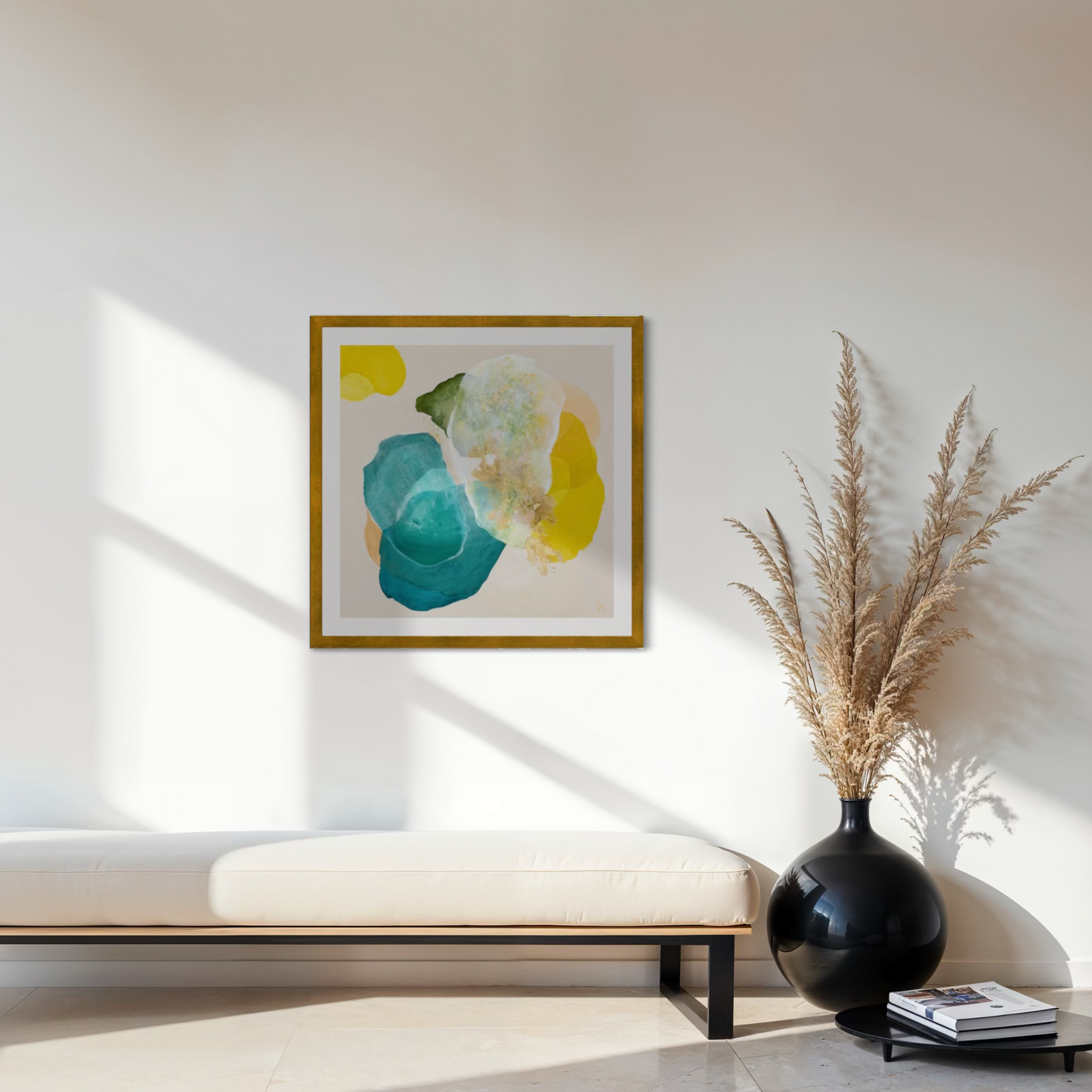 Bold abstract art print for living room on paper. Framed in a gold finish, hanging above a bench. Ingeborg Andersson Art