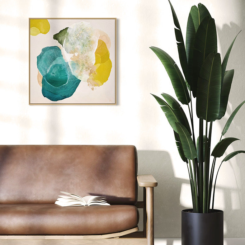 Cosmic Gold, bold abstract art print for living room with vibrant teal and golden yellow contrasts and rich texture. Hanging in a reading nook. Ingeborg Andersson Art