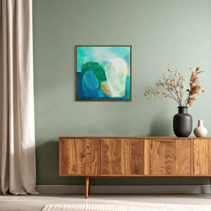 Gems, abstract coastal wall art print with deep teal and turquoise tones, organic stone shapes and rich layered texture. Hanging framed in a modern living room. Ingeborg Andersson Art