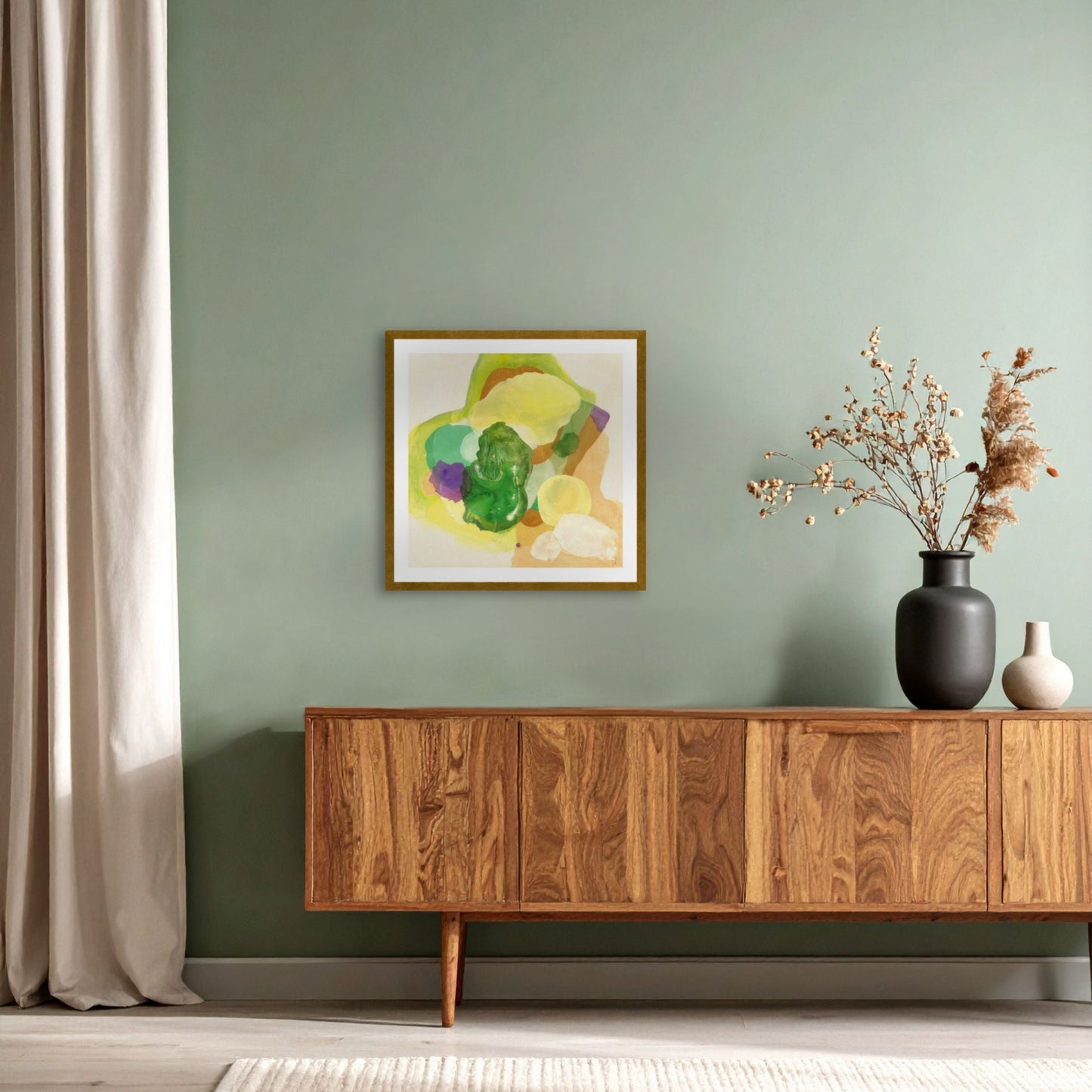 The Frog, organic abstract art print on paper with a classic frame in gold finish, hanging above a cabinet. Ingeborg Andersson Art